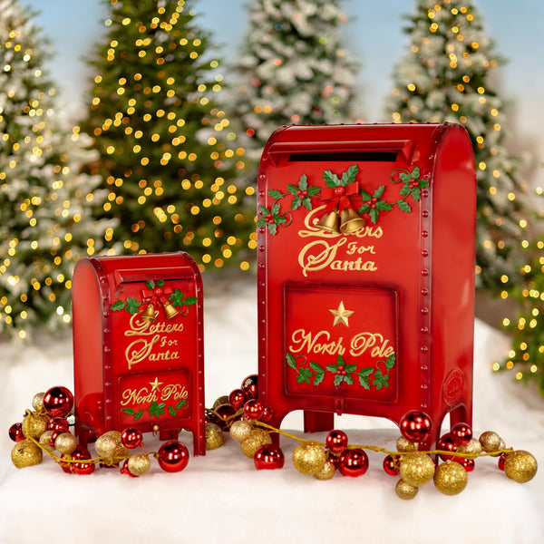 Two red iron Letters to Santa Christmas mailboxes, medium and small, with gold lettering and holly