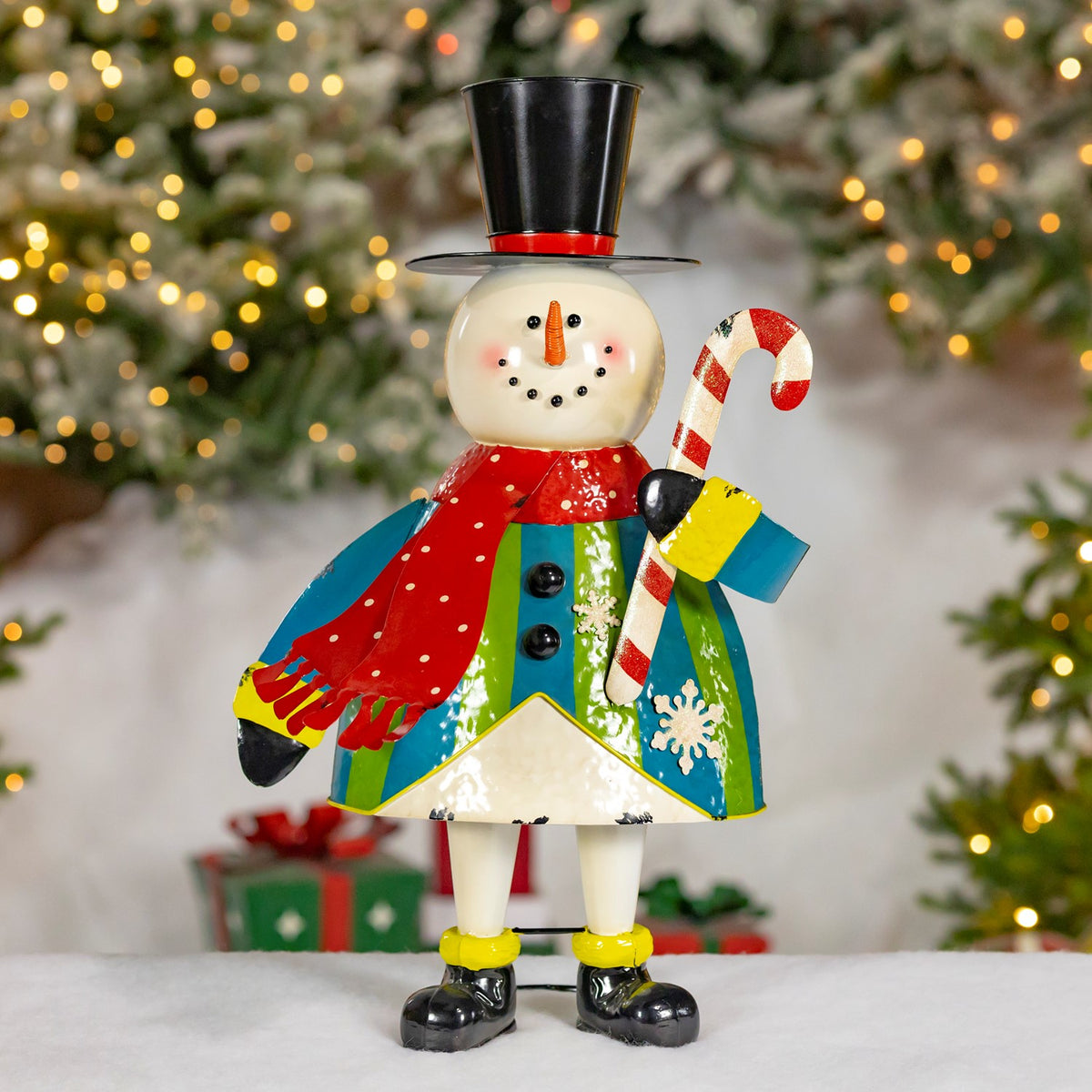 25.5 inch hand painted iron snowman figurine in a top hat and scarf holding a candy cane, distressed finish