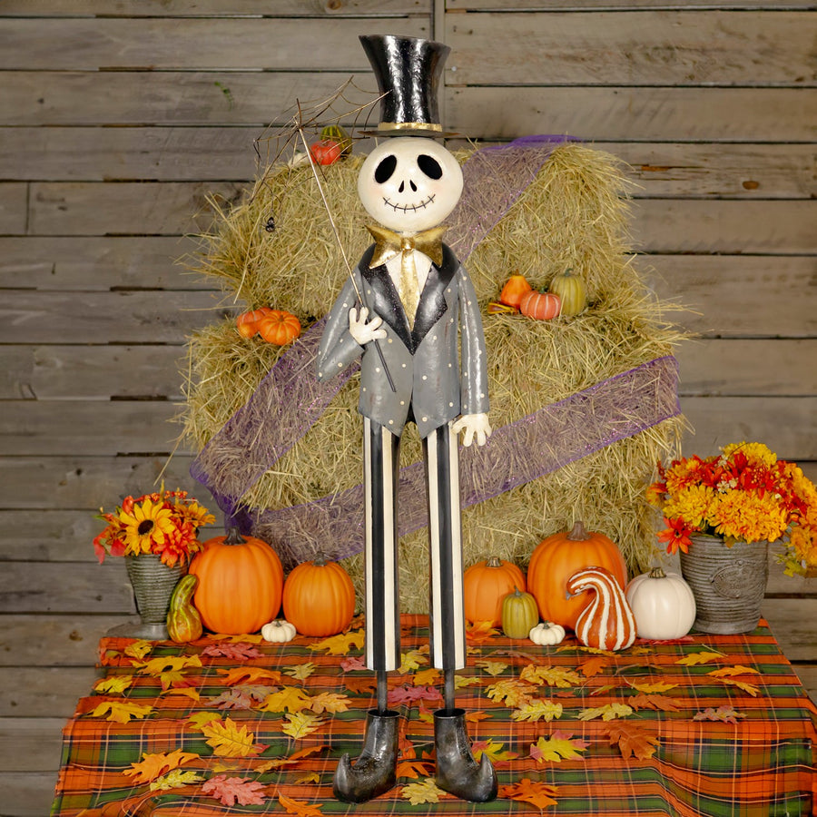 54.25 inch iron skeleton gentleman holding a spider web umbrella, distressed black and white hand painted finish