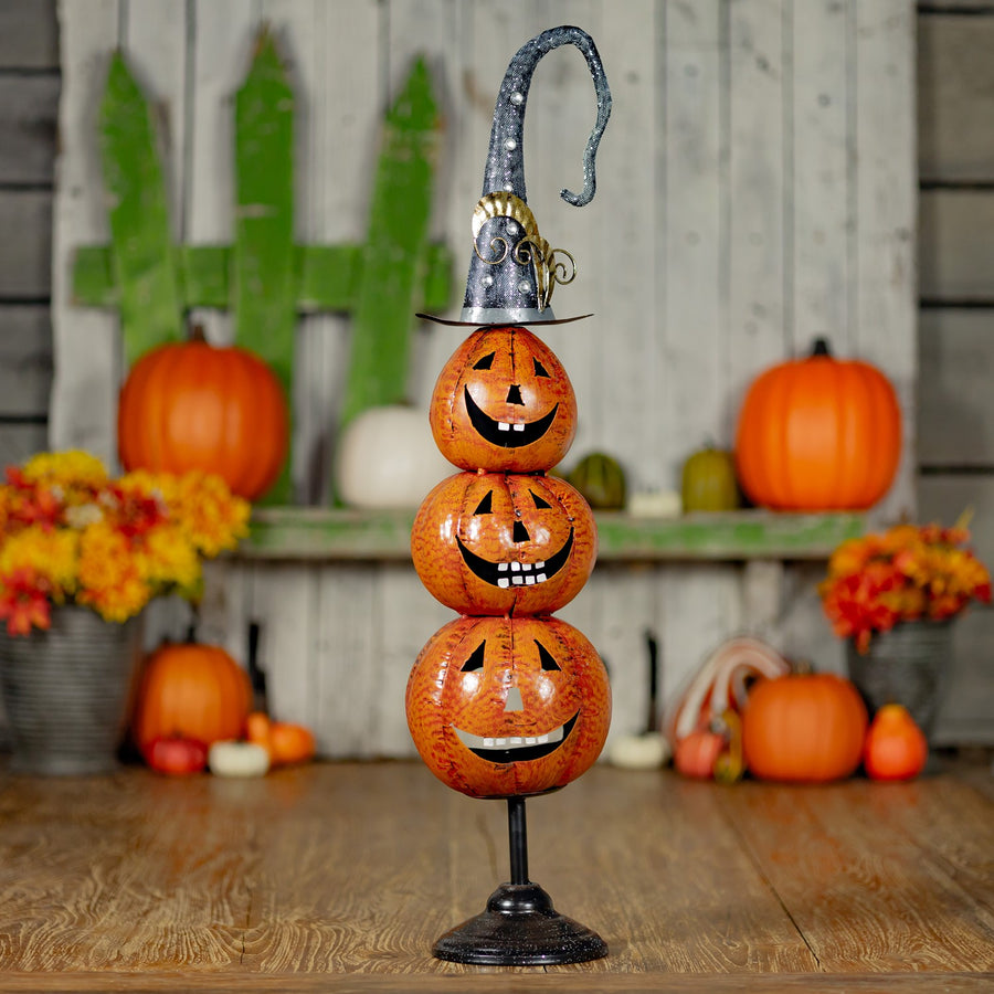 32.75 inch hand painted metal jack-o-lantern totem tower on a stand, orange and black