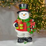 25.1 inch hand painted polyresin snowman with presents, wreath, and lantern with electric candle