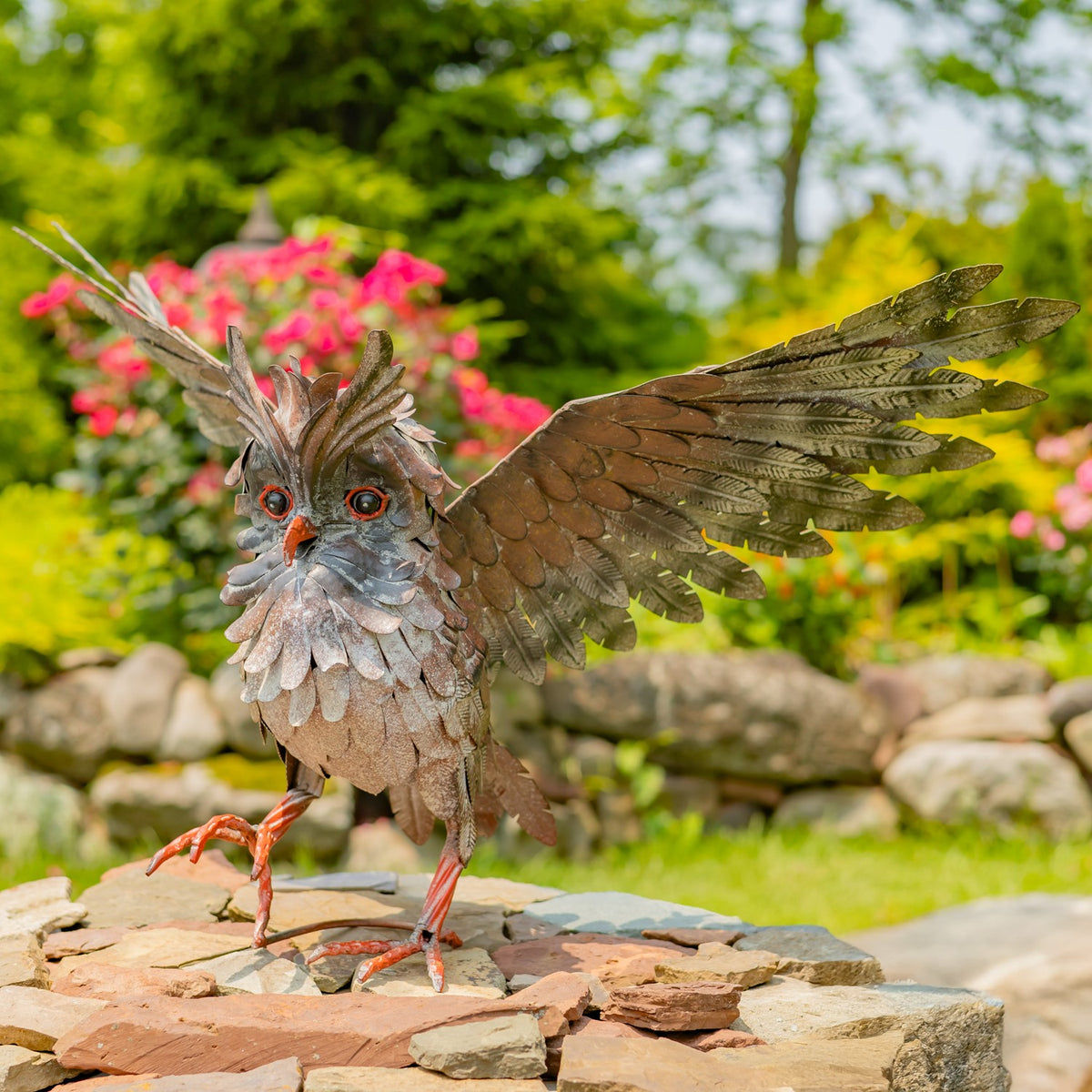 Soaring metal great horned owl garden statue in a black-grey matte finish