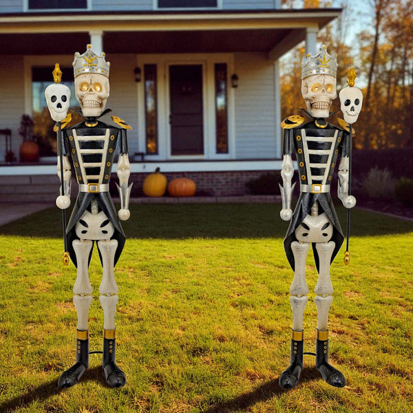 Pair of five foot silver ancient skeleton sentry figures holding skull staffs, distressed silver hand painted finish