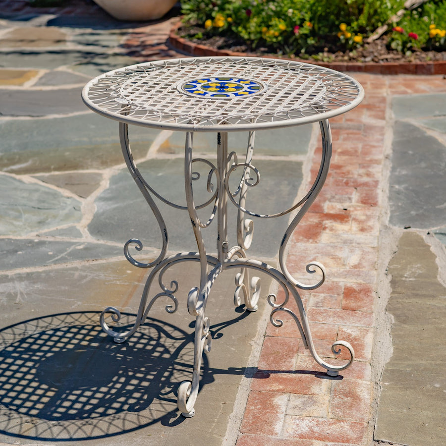 San Marino round mosaic bistro table with a hand laid ceramic top and a distressed Antique White iron frame