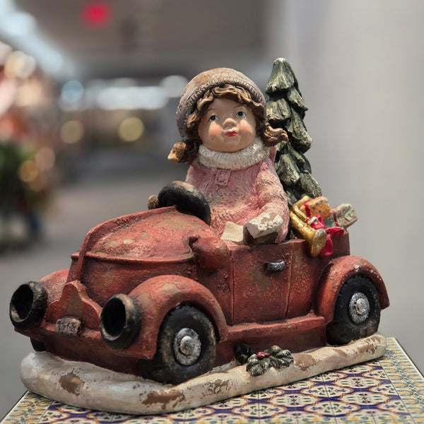 21 inch vintage style girl driving a red truck with a Christmas tree and wrapped gifts, hand painted polyresin