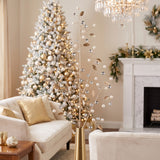 Pearl, gold and silver bead Christmas sprays in a gold vase in an ivory and gold sitting room