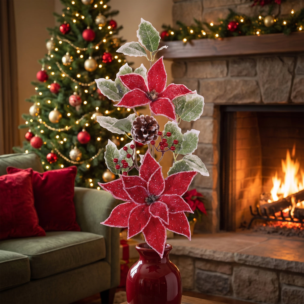 Red poinsettia and frosted holly Christmas sprays in a red vase on a hearth in a traditional living room