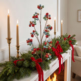 Red, blue, green and gold sleigh bell sprays tucked into an evergreen mantel garland