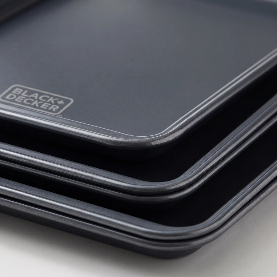 Close-up of the rolled rim and ceramic nonstick surface of a BLACK+DECKER carbon steel baking sheet