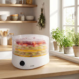 Commercial Chef 5-tray food dehydrator on a sunny kitchen counter with dried herbs hanging behind