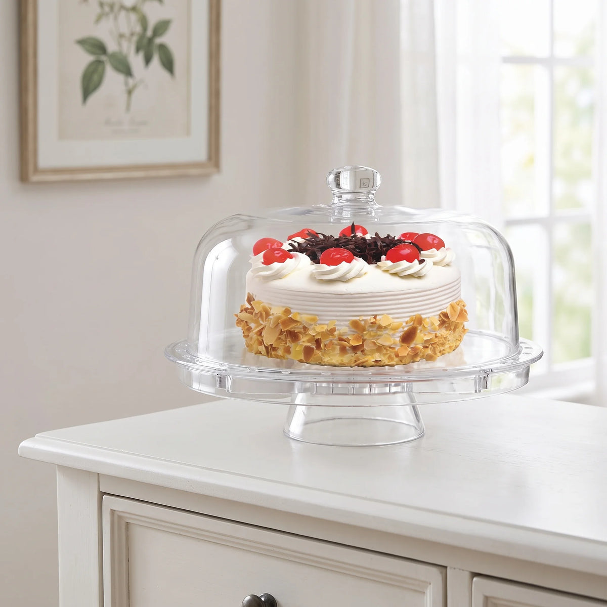 Fridgemate clear acrylic cake stand with dome cover on a dining room sideboard