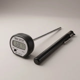 Taylor 3516 digital instant read pocket thermometer with LCD display, stainless steel stem and black pocket sleeve on a studio surface