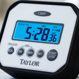 Close-up of the blue backlit LCD, buttons and rubber bumper on a Taylor splash and drop water resistant timer