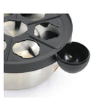 Close-up of the Better Chef egg cooker tray with its egg cups and cool-touch handle