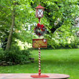 Standing iron Christmas lantern with LED lights and poinsettia wreath, product photo 1