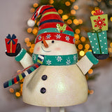 Iron snowman holding presents figurine, front view