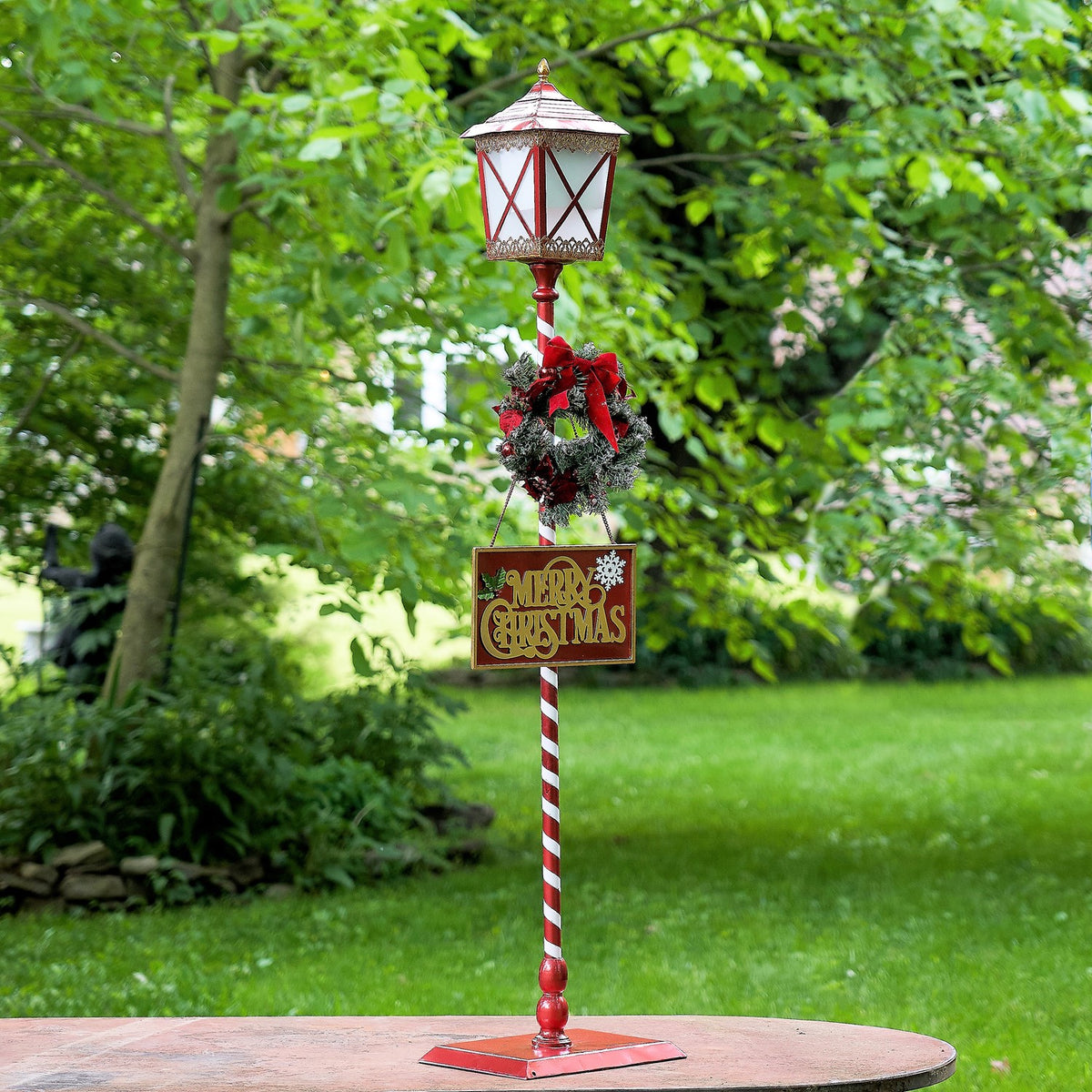 Standing iron Christmas lantern with LED lights and poinsettia wreath, product photo 2