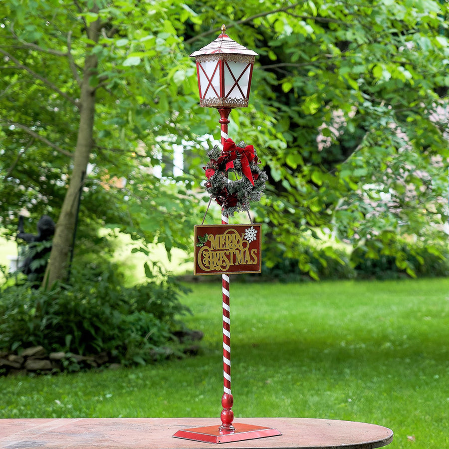Standing iron Christmas lantern with LED lights and poinsettia wreath, product photo 2