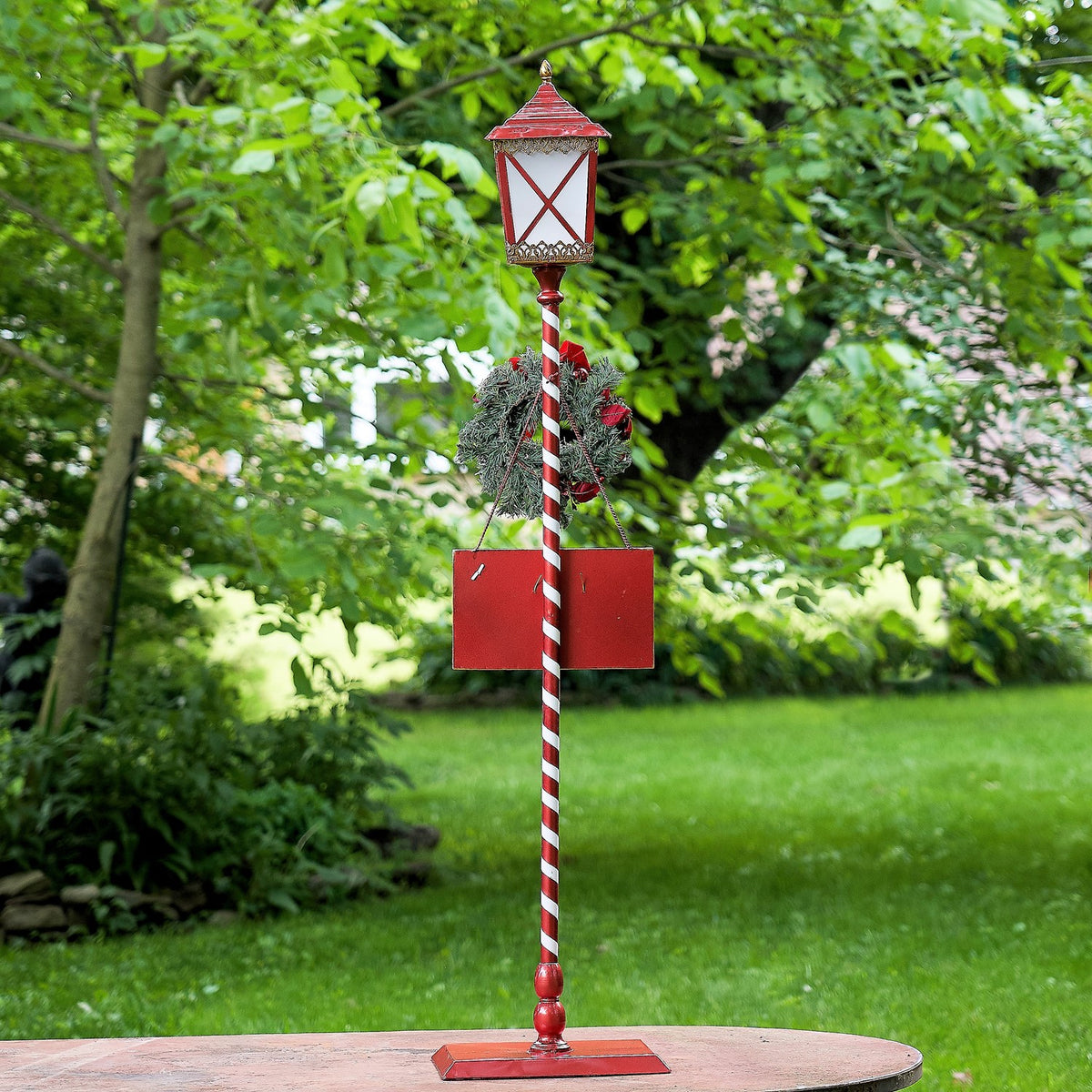 Standing iron Christmas lantern with LED lights and poinsettia wreath, product photo 3