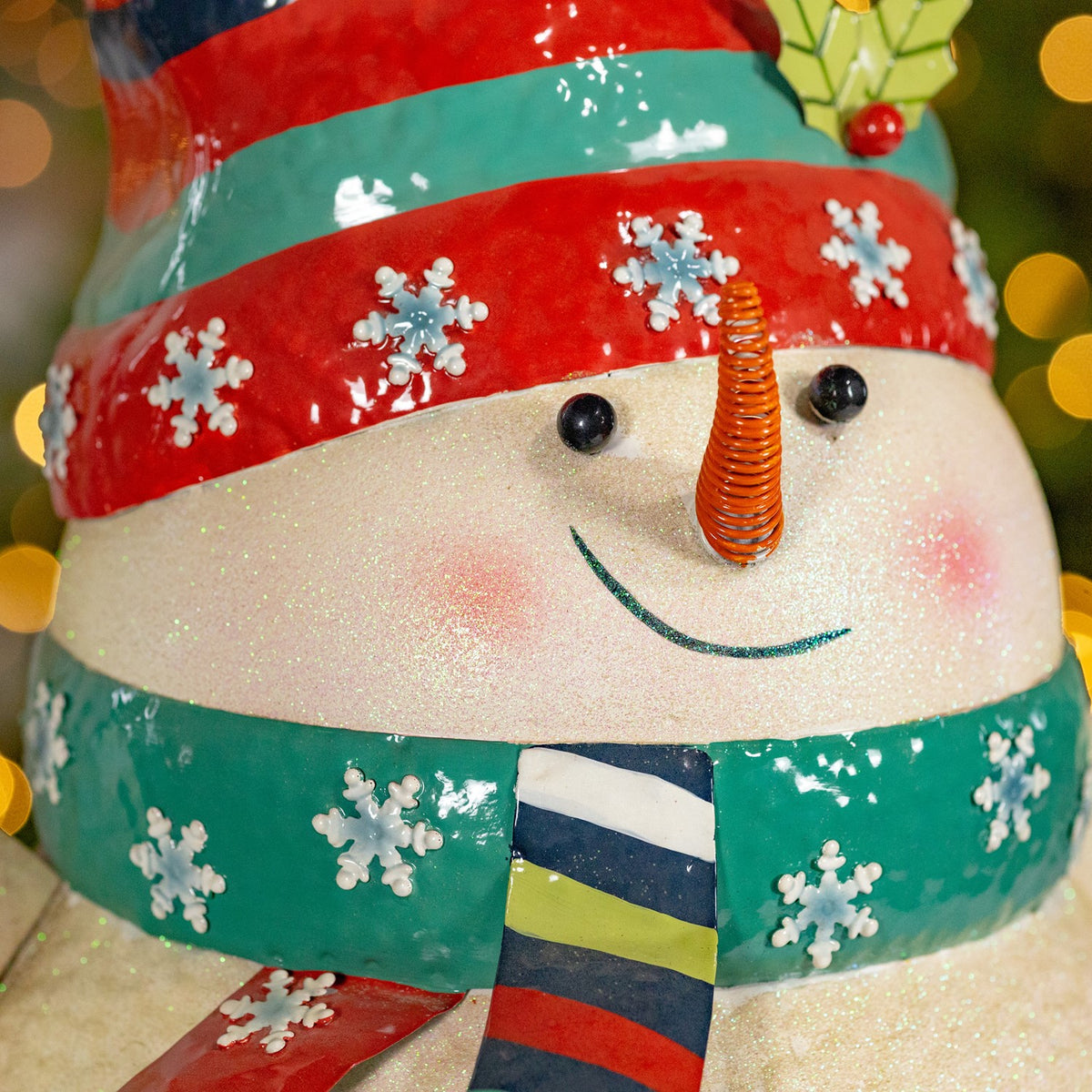 Iron snowman holding presents figurine product photo