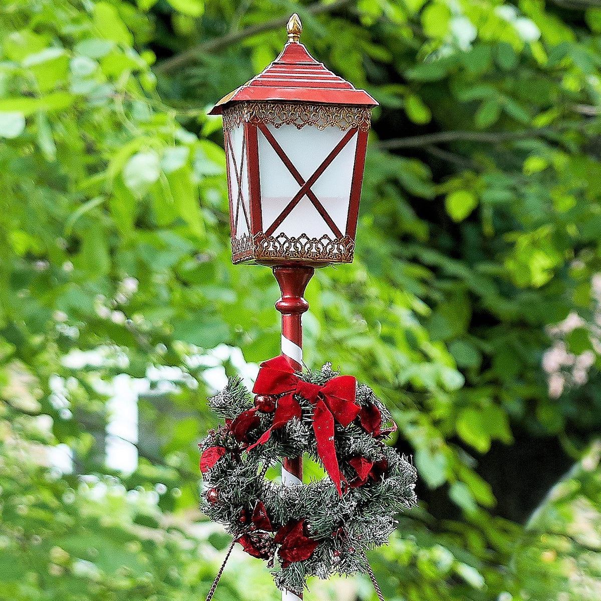 Standing iron Christmas lantern with LED lights and poinsettia wreath, product photo 4