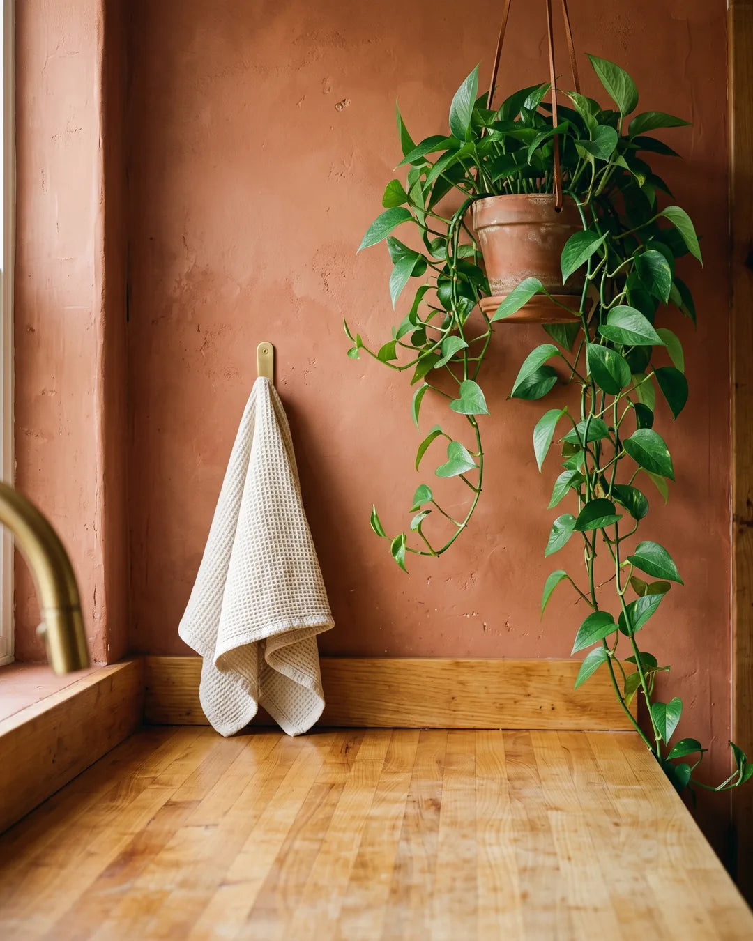 Six colorful Crock-Pot Artisan enameled cast iron Dutch ovens on a butcher-block counter in a warm terracotta kitchen, matching our Pinterest collection.